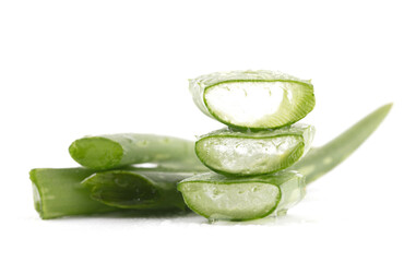 Cut pieces of fresh aloe on white background