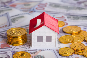 House model on coins money for saving to buy a house