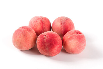 Ripe peach fruit close-up isolated on white background