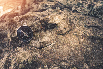 Fototapeta na wymiar The compass of a traveler who is traveling.