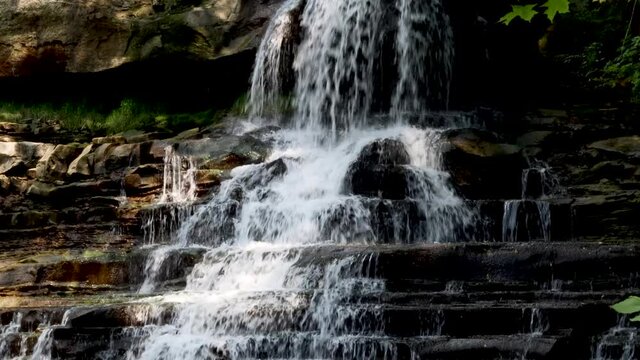 A gushing waterfall in the middle of an urban landscape. Brandywine falls in the middle of Cleveland Ohio.