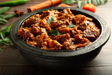 Kerala mutton curry roast- cooked in earthenware, clay pottery, traditional Malabar recipes.