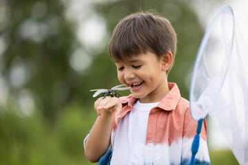 boy with dragonfly on hand