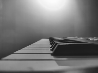 Close up Black and White stock photograph of a Piano keyboard and notes for playing music 