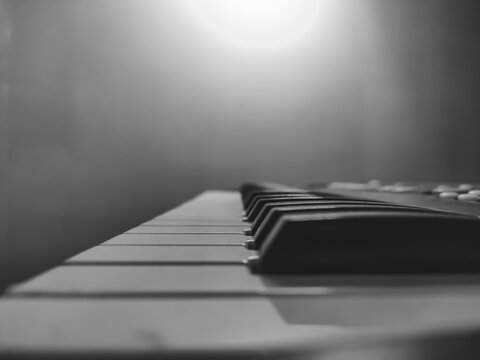 Close up Black and White stock photograph of a Piano keyboard and notes for playing music  - Powered by Adobe