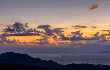 Sunrise landscape panoramic view with orange cloud sky and misty at Chiang Rai province northern of Thailand