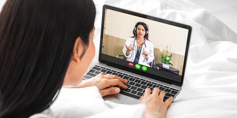 Fototapeta na wymiar Woman talk speak using laptop computer and video conference online with doctor and stethoscope service help support team discussing and consulting talk video chat call checkup information at home
