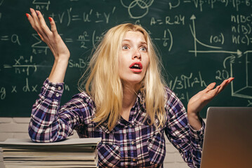 Back to school. Tired student learning at home. Knowledge day. Education and campus people concept. Girl stressed by studying to hard screaming classroom background.