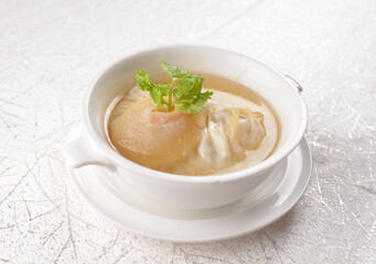 chinese double boiled shark's fin hot soup with meat dumpling wanton in white bowl hong kong dim sum menu