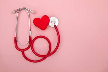 Red Stethoscope with Shape of Heart , the doctor medical use to diagnose heartbeat ,World heart day...