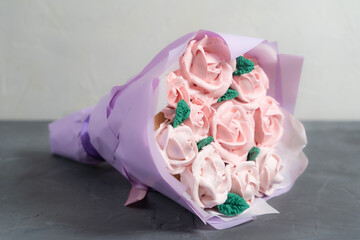 Bouquet of marshmallows. Marshmallow roses and tulips are collected in a bouquet. Packed in paper and gift box. A sweet gift for loved ones. A gift to your beloved.