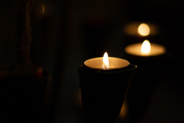 candles lit in the dark of a church
