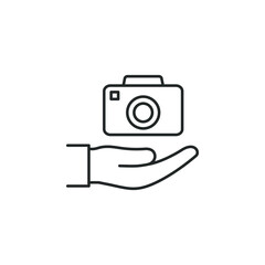 Camera on hand icon line style isolated on white background. Vector illustration