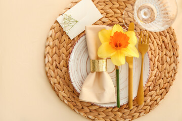 Beautiful table setting with narcissus flowers