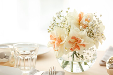 Beautiful table setting with narcissus flowers