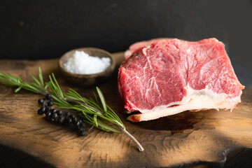 Raw beef filet Mignon steak on a wooden Board 