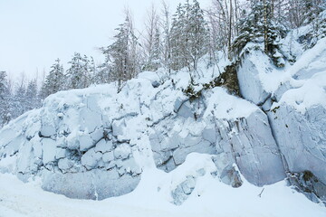 frozen rocks in frost and snow