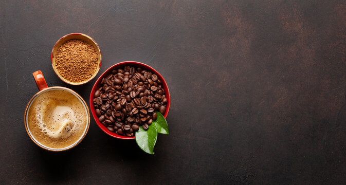 Roasted coffee beans, ground powder and espresso cup © karandaev