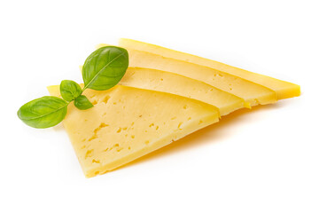 Pieces of semi-hard or hard yellow cheese with holes and basil leaf isolated on a white background.