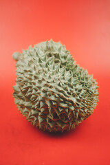 Naklejka na ściany i meble Closeup Durian on a red background
