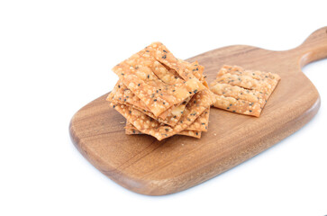 Fried crispbread on cutting board on white background
