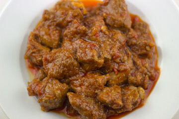 plato tipico de cerdo en salsa, typical spanish dish of pork in sauce
