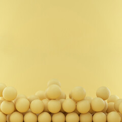 Spheres on yellow studio background with space for text or design.