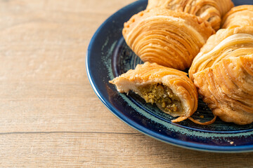 curry puff stuffed chicken on plate