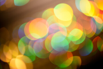 Large Rainbow Circles of Bokeh in rows .Beautiful bright defocused multicolor rounds.