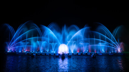 colorful fountain dancing in celebration of year with dark night sky background.