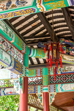 Chinese traditional corridor with painted palace lanterns in Baomo Garden, Guangzhou, China