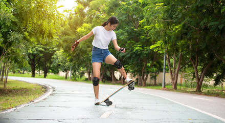 Asian women leg on surf skate or skate board