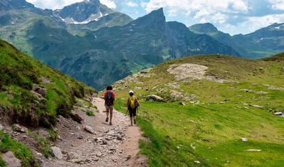 Fototapeta na wymiar Two hiker women in path of Pic du Midi Ossau in French Pyrenees mountains