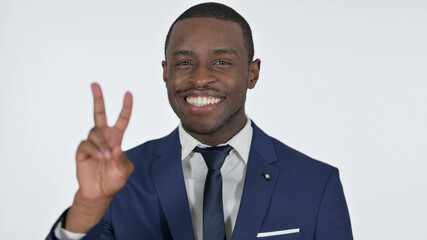 Victory Sign by Young African Man, White Background