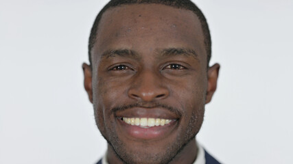 Close up of Smiling Young African Man, White Background 