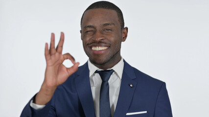 Ok Sign by African Businessman, White Background