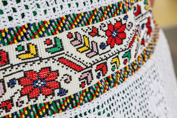 traditional clothes and beaded jewelry. traditional ornaments and patterns. handmade.