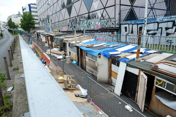 Some homeless shelters, garbage and waste in the east of Paris. July 2021, Paris, France.