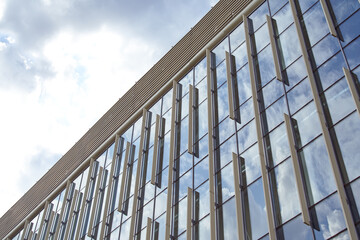 View of the architectural structure with glass windows. Modern building