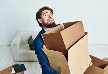 manager with boxes new place of work unpacking relocation