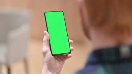 Man Using Smartphone with Green Chroma Screen 