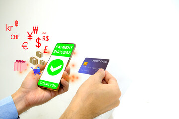 A man holding a smartphone, credit card, and payment online for shopping. Pays off in many currencies. Online shopping on mobile phone concept.