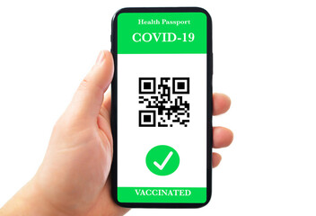 Vaccinated person holding mobile phone with digital health passport for travel during covid-19 pandemic. Green certificate. Certificate of vaccination on mobile phone screen with qr-code. 