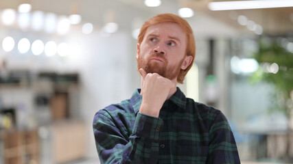 Naklejka premium Portrait of Redhead Man Thinking New Plan