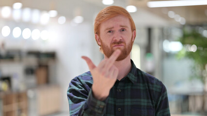 Obraz premium Portrait of Angry Redhead Man showing Middle Finger 