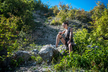  female holding machete at nature