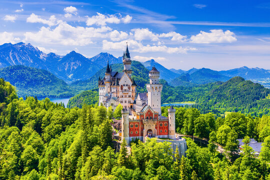 Neuschwanstein Castle, Germany. Front view of the castle with the Bavarian Alps in the background.
