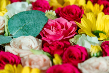 Fototapeta premium beautiful bouquet of roses and wildflowers