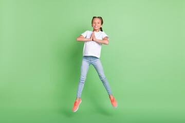 Fototapeta na wymiar Full length body size photo little girl jumping up asking wish isolated pastel green color background