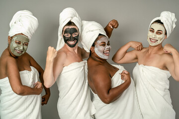 Happy multiracial women having skin care spa day - People selfcare concept